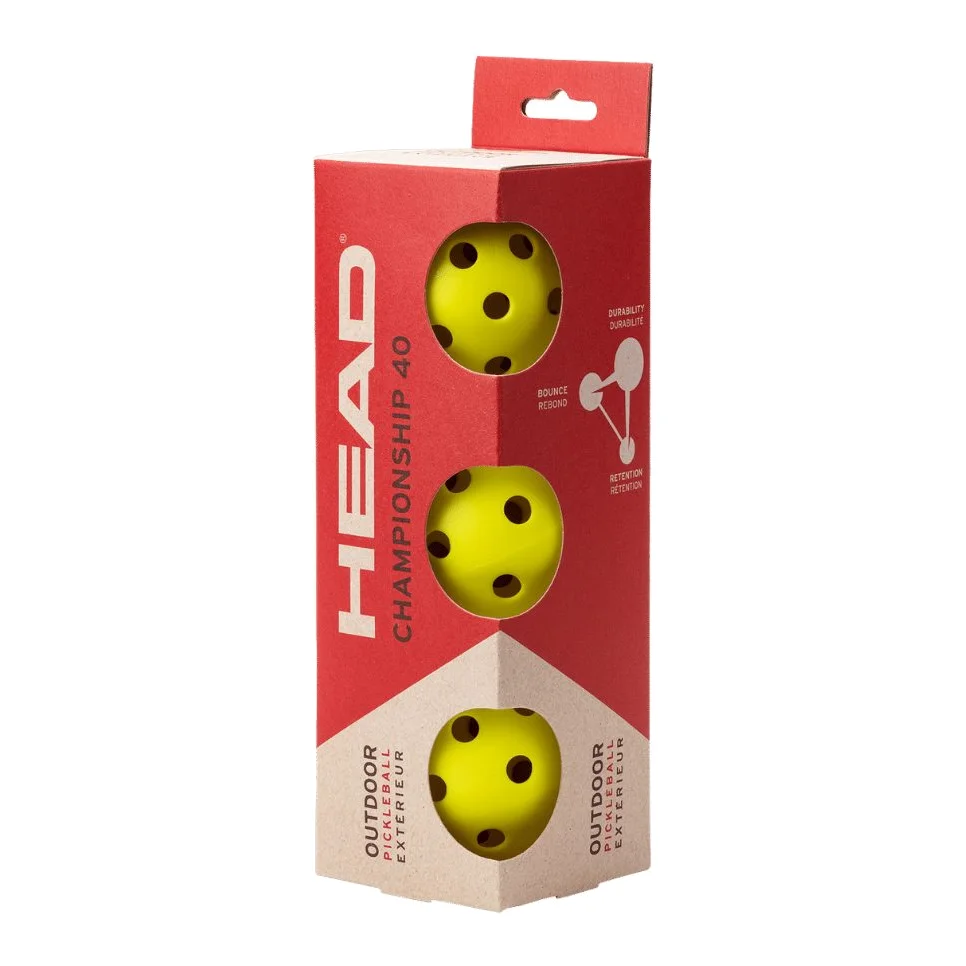 Drie felle gele HEAD Championship 40 pickleballballen liggend op een sportondergrond
